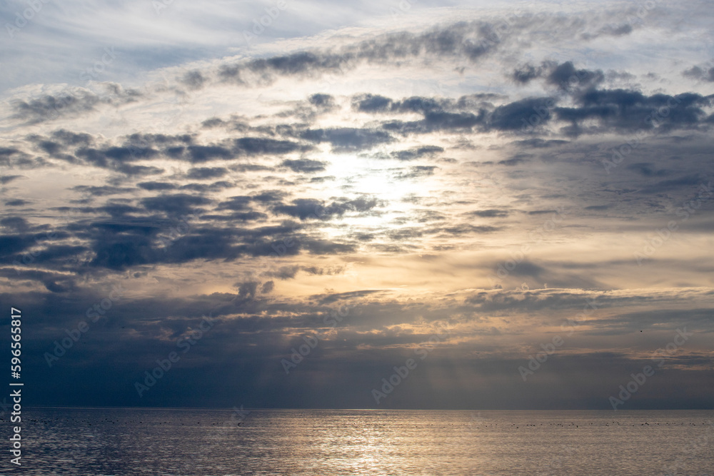 Sunset on the sea, sky with clouds, summer.