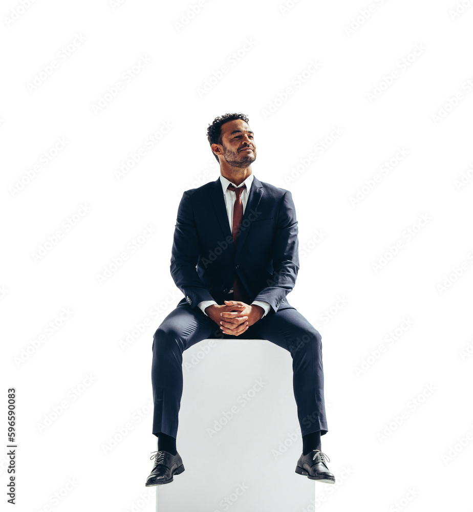 Contemplative businessman sitting on top of a block on a transparent background