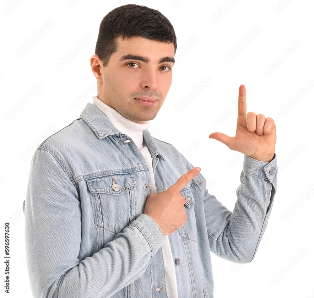 Young man showing loser gesture on white background