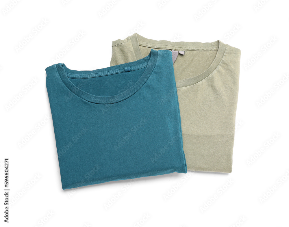 Folded blue and grey t-shirts on white background