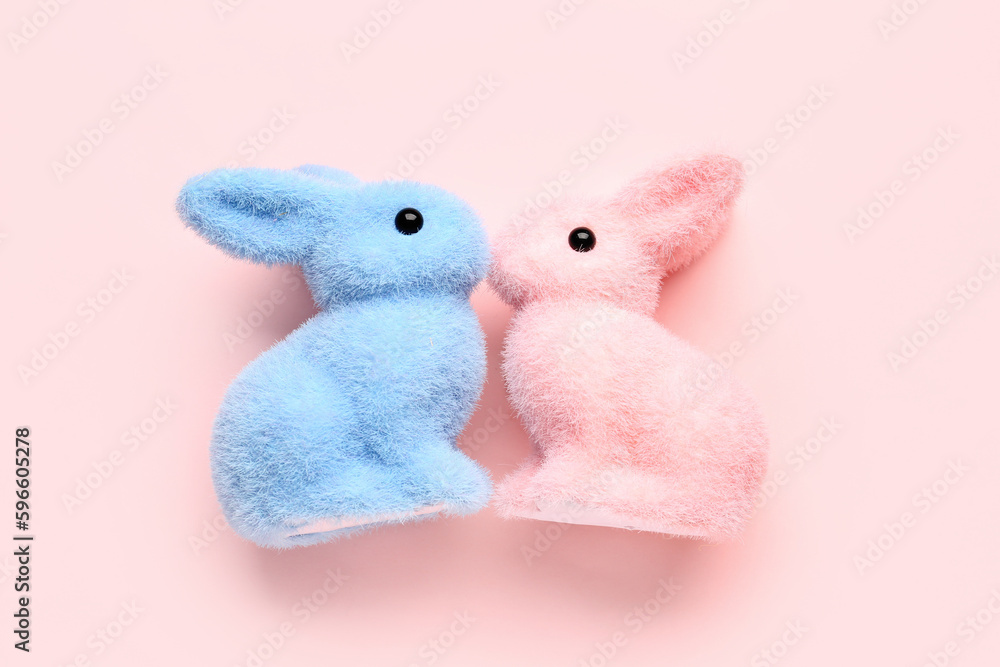 Cute bunnies for Friendship Day on pink background