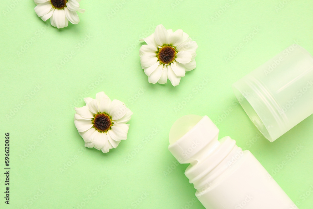 Deodorant with flowers on light green background