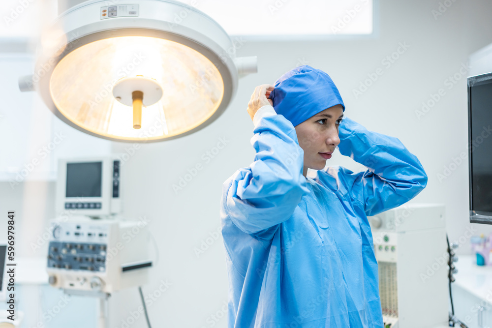 Professional doctors performing surgical operation in operating room. 