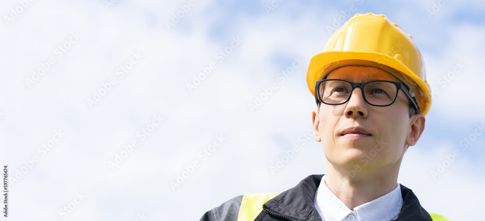 Portrait of engineer in helmet and glasses	