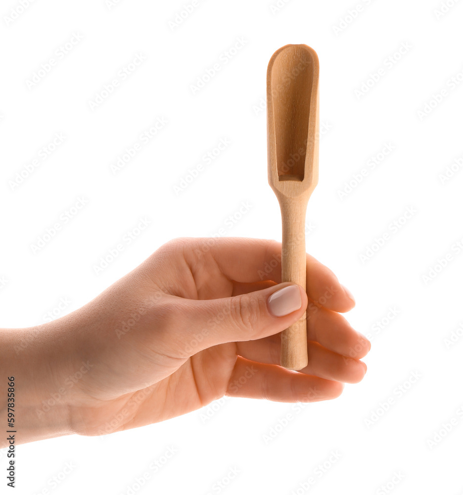 Female hand with wooden scoop isolated on white background, closeup