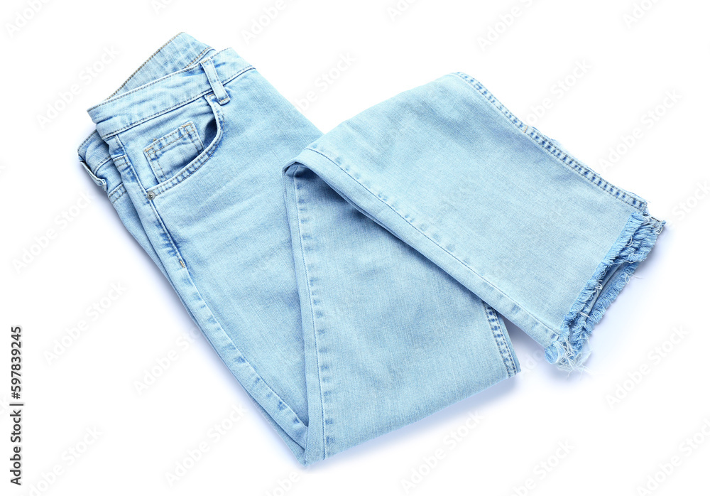 Folded jeans on white background