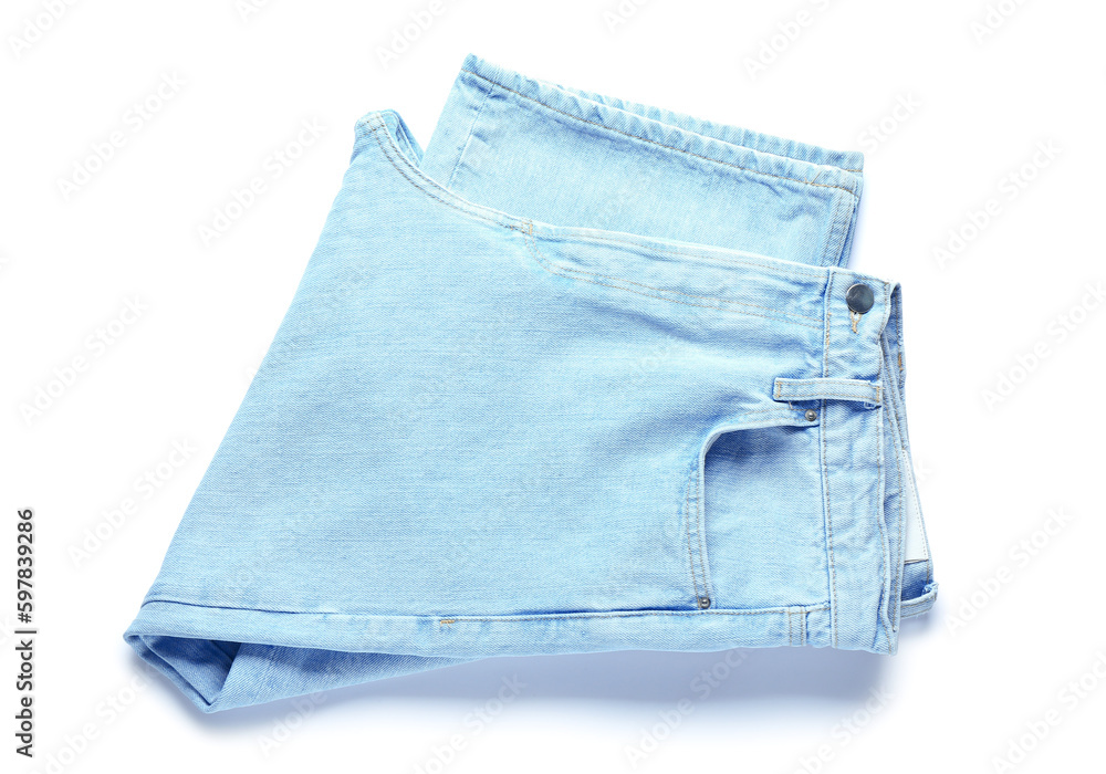 Folded jeans on white background