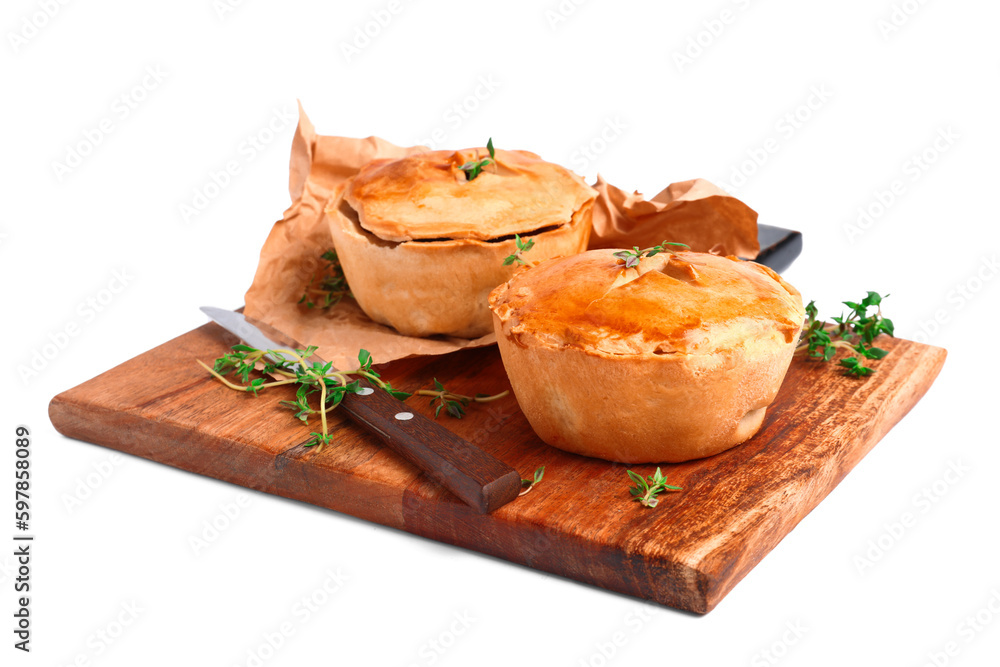 Wooden board with tasty meat pot pies on white background