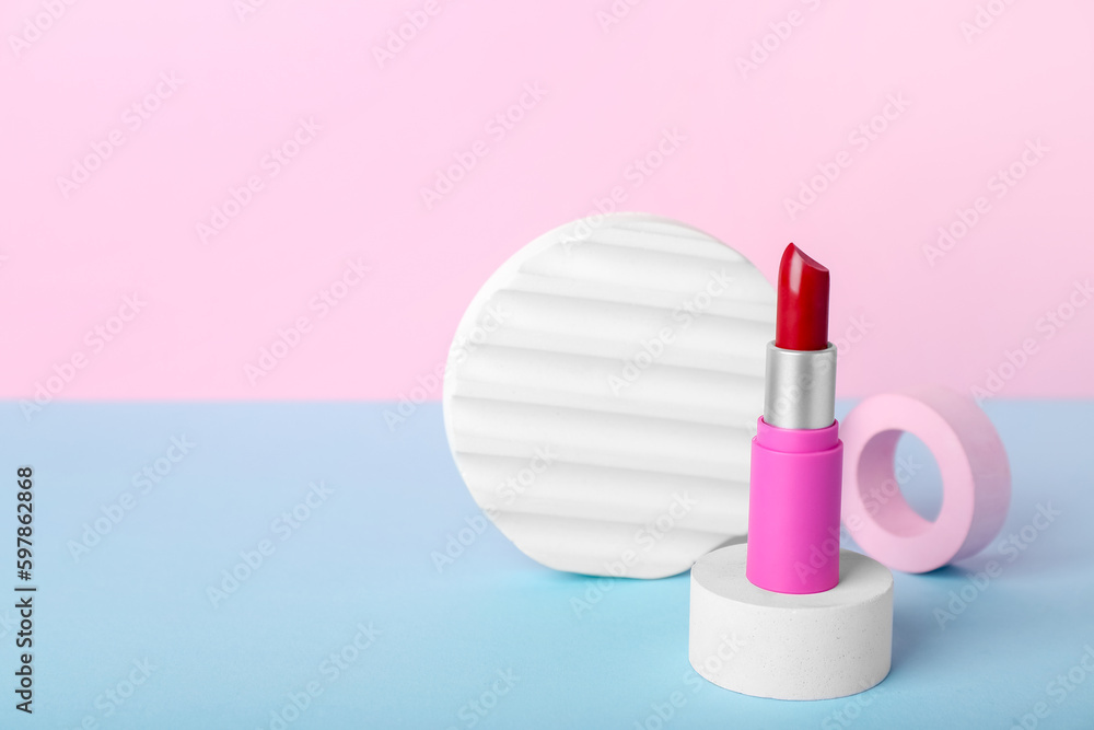 Decorative plaster podiums and lipstick on color background