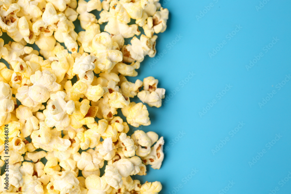 Crispy popcorn on blue background