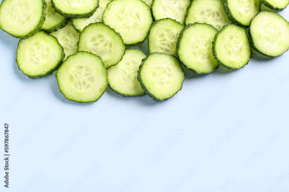 Slices of cucumber on blue background