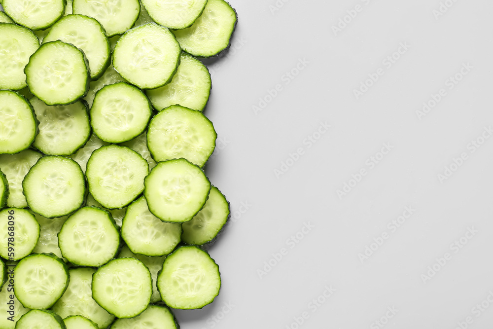 Slices of cucumber on grey background