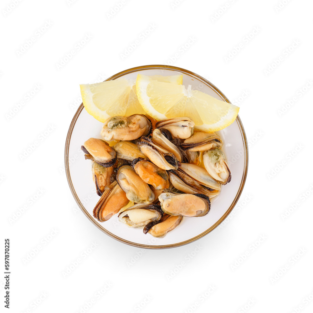 Marinated mussels with lemon slices in glass bowl on white background