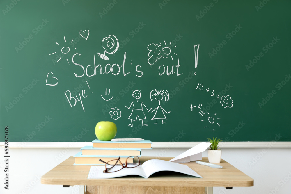 Text SCHOOLS OUT with drawings on blackboard in classroom