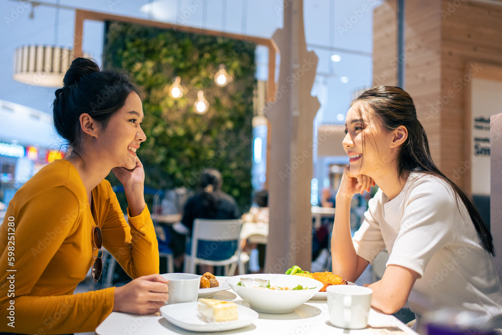 Asian beautiful women having dinner with friend in restaurant together. 