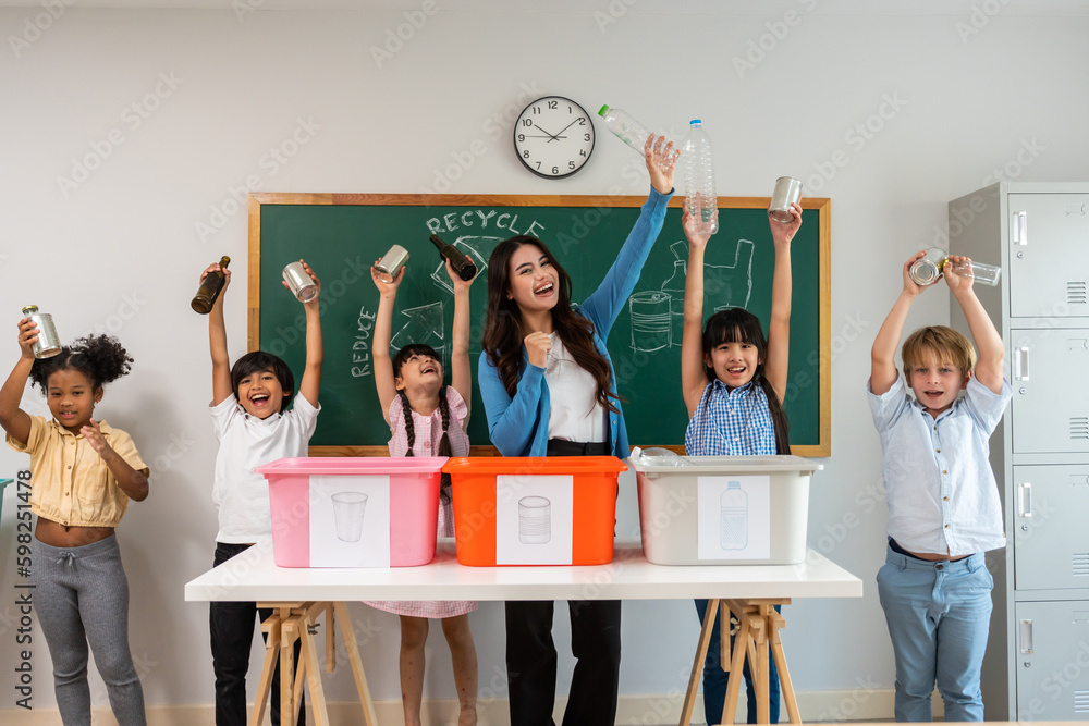 Group of student learn with teacher in classroom at elementary school. 