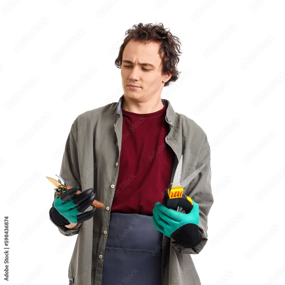 Thoughtful male gardener with secateurs on white background