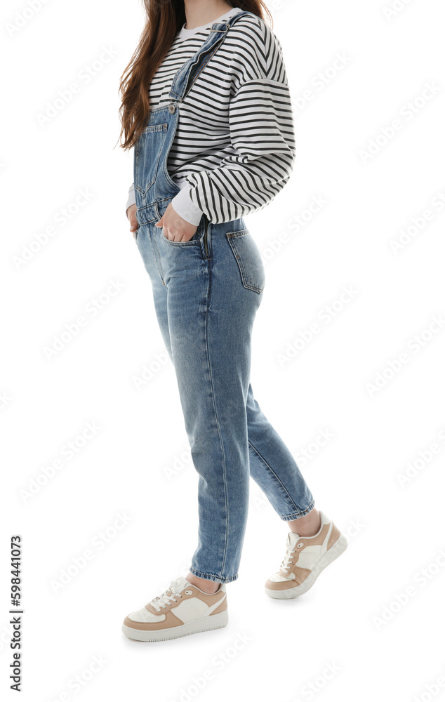 Young woman in denim jumpsuit on white background