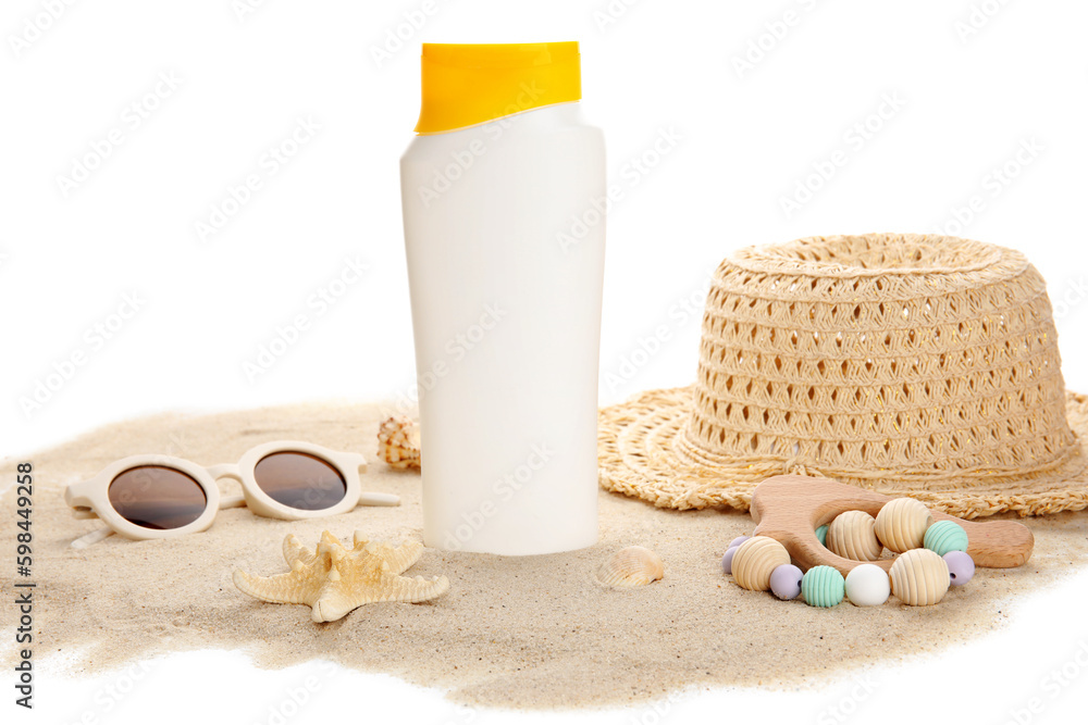 Sunscreen cream for baby with beach accessories and sand on white background