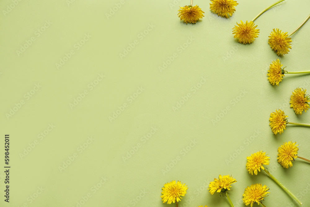 Bright dandelions on light green background