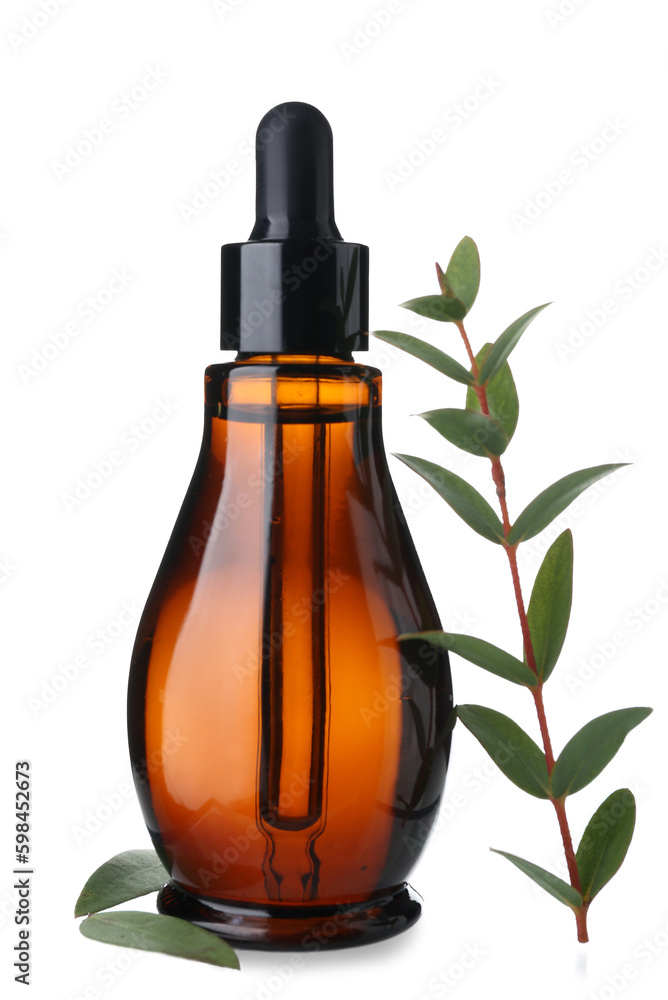 Bottle of cosmetic oil with eucalyptus twig on white background