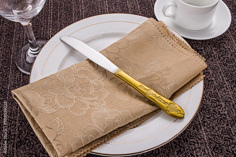 Stainless steel tableware and kitchen utensils placed on the desktop