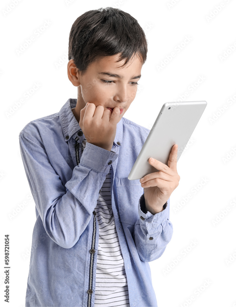 Little boy with tablet computer biting nails on white background