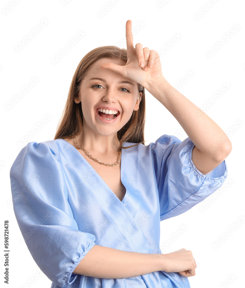 Young woman in dress showing loser gesture on white background