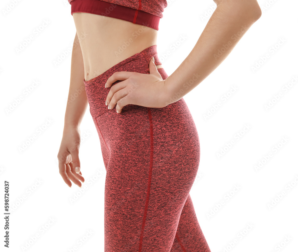 Sporty young woman in leggings on white background, closeup