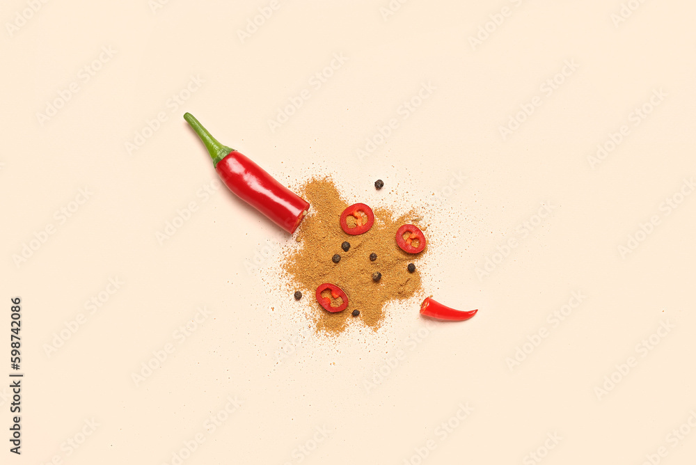 Fresh chili pepper and spices on pale orange background