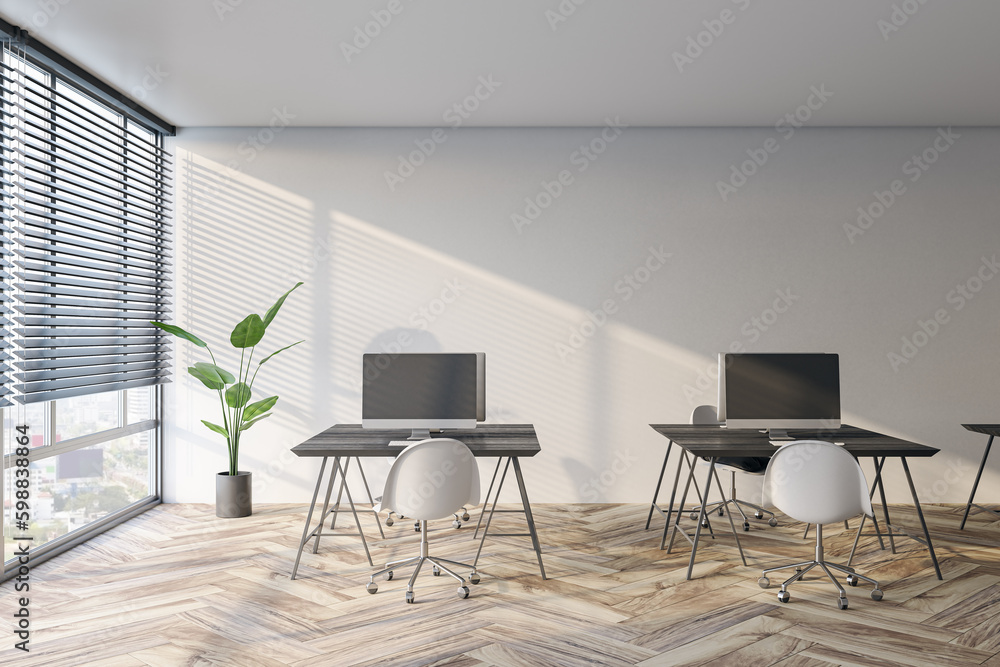 Modern coworking office interior with window and city view, blinds, workspaces and wooden flooring. 