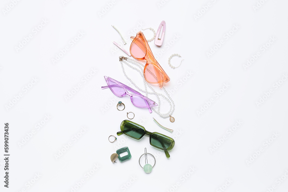 Jewelry with sunglasses on white background