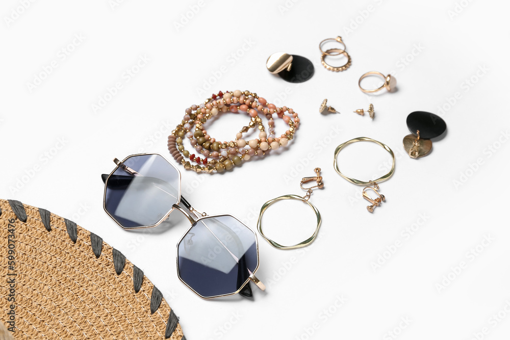 Jewelry with sunglasses on white background