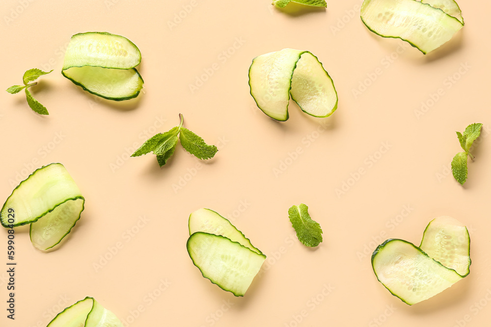 Slices of cucumber with mint on beige background