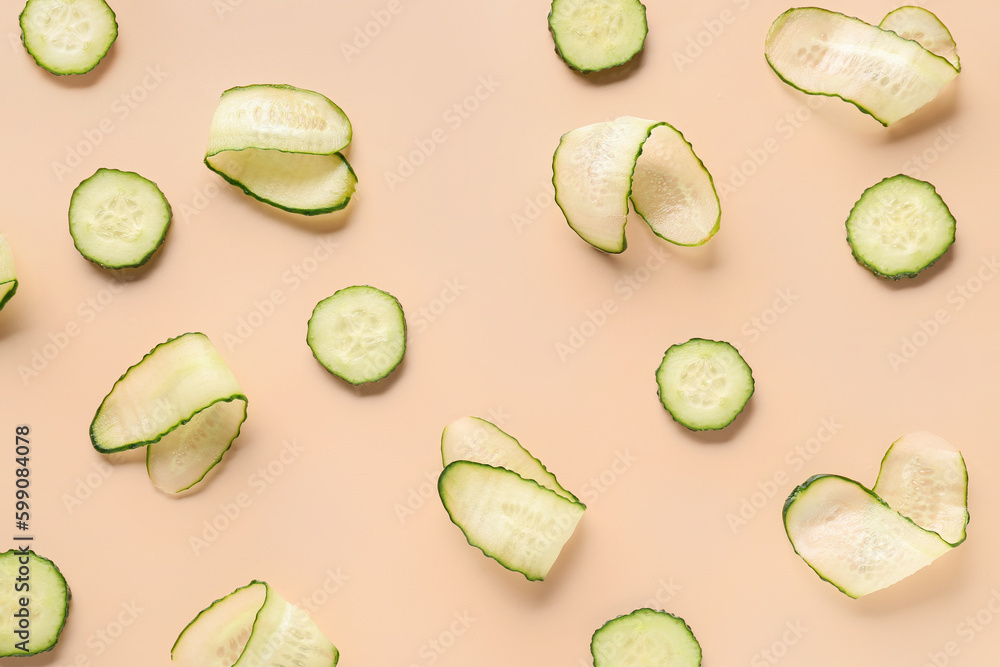 Slices of cucumber on beige background