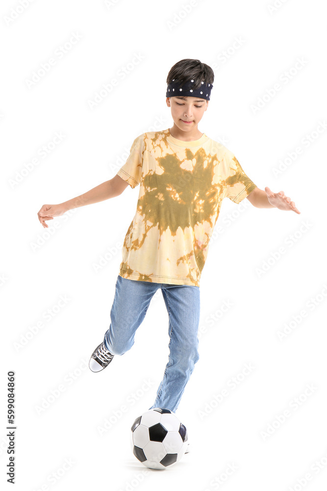 Little boy playing with soccer ball on white background