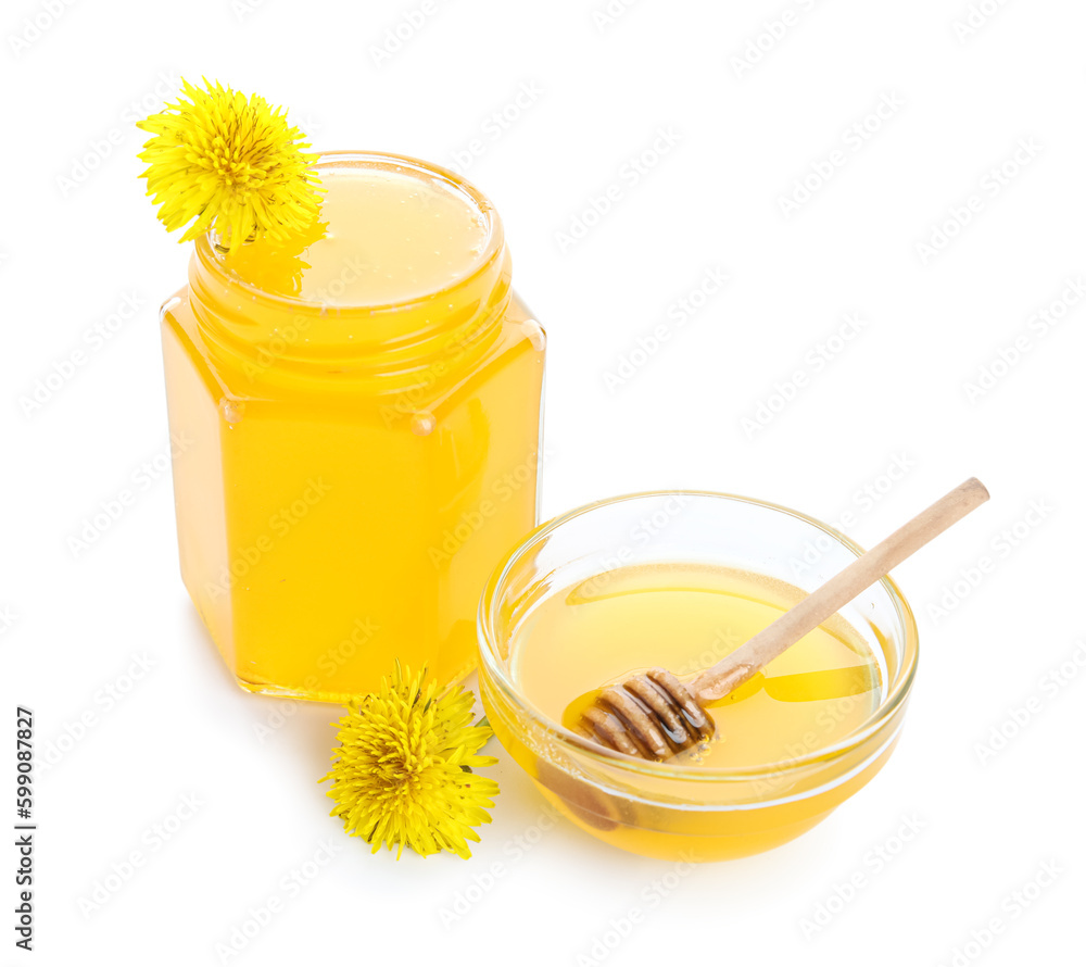 Jar and bowl with dandelion honey on white background