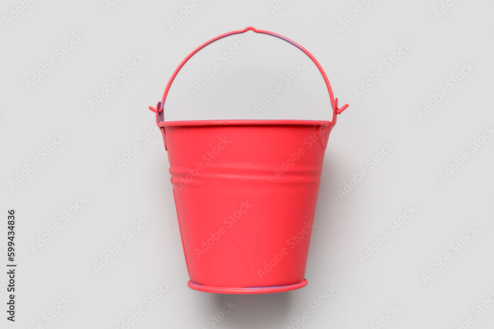 Red bucket on light background