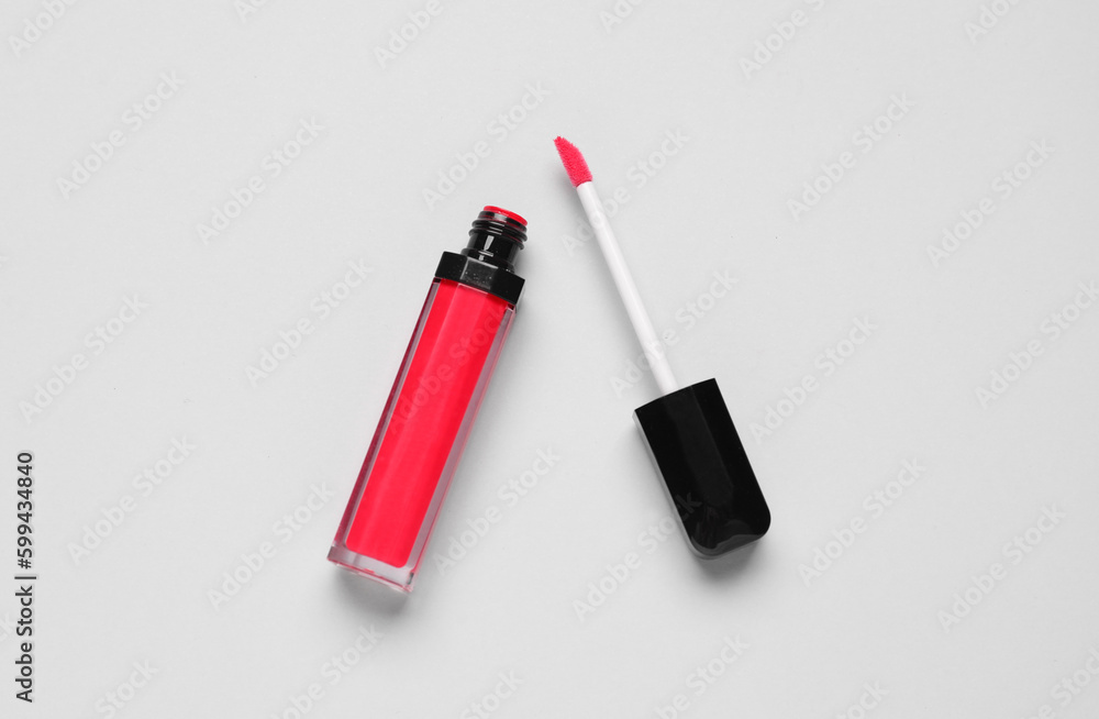 Red lipgloss on light background