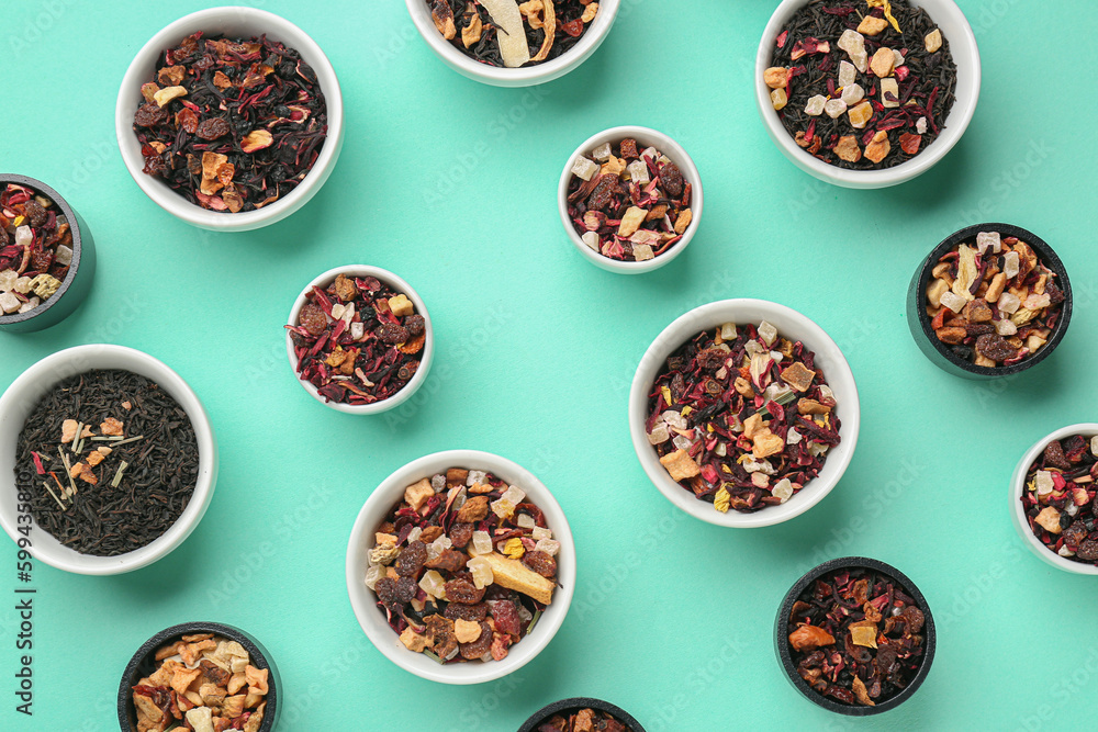 Assortment with different types of dried fruit tea on turquoise background