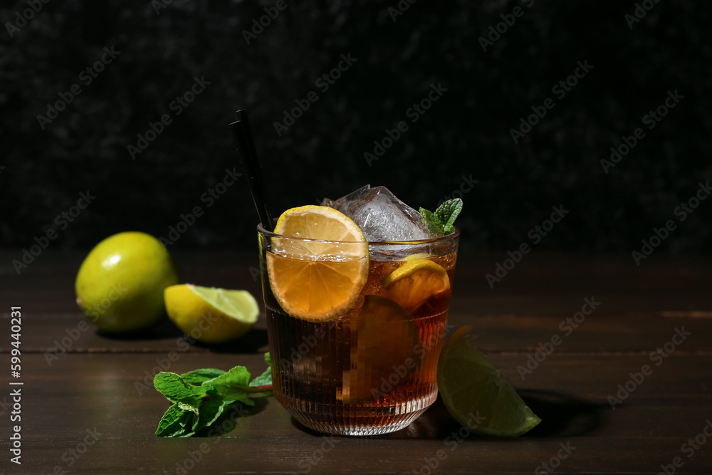 Glass of tasty Cuba Libre cocktail on table