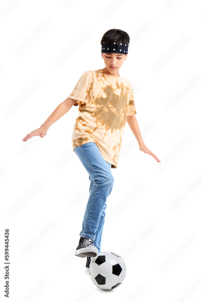 Little boy playing with soccer ball on white background