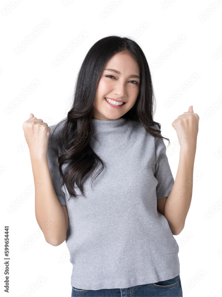 Young Asian cheerful excited girl say yes, looking happy and celebrating victory rejoice success fis