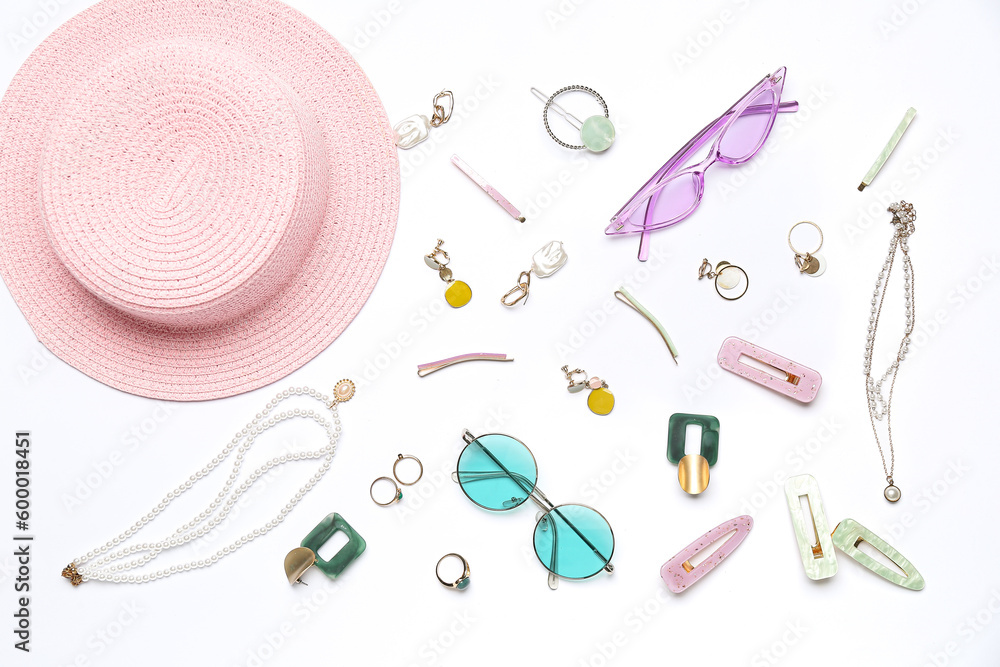 Accessories with sunglasses and summer hat on white background