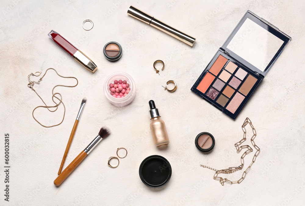 Composition with decorative cosmetics and stylish female accessories on light background