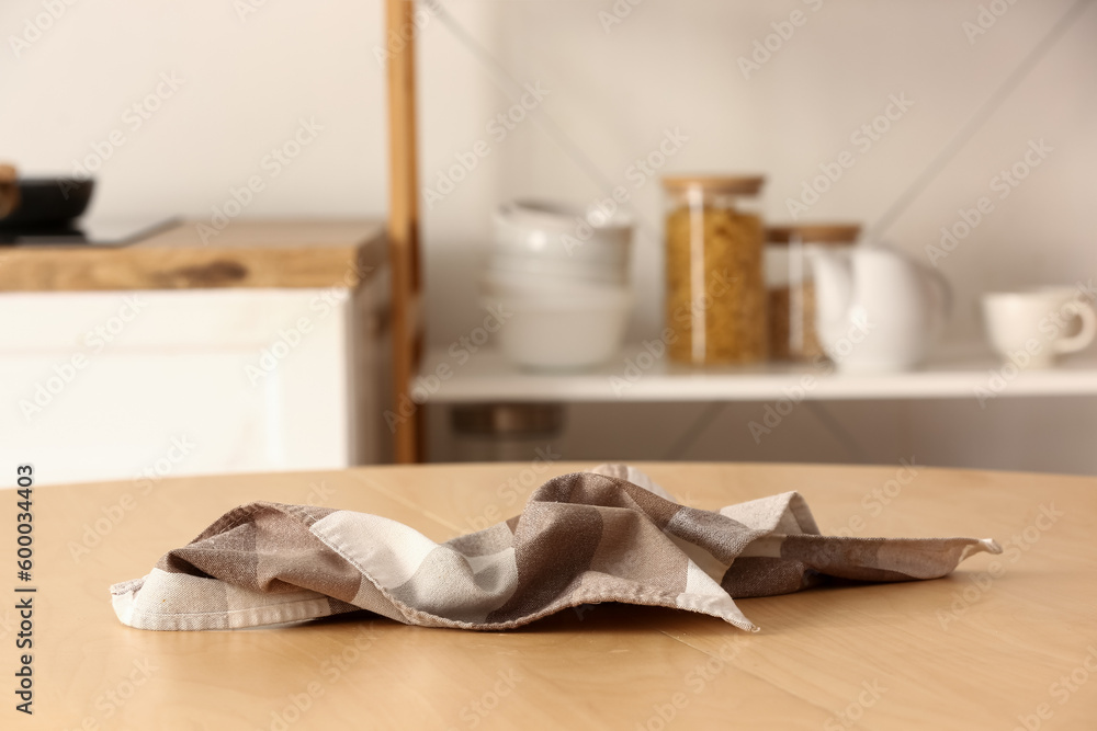 Crumpled napkin on table in kitchen