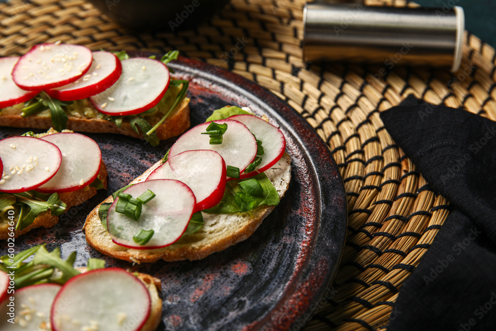 Plate with delicious radish bruschettas, closeup