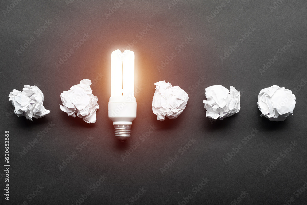 Fluorescent lamp and crumpled white paper balls