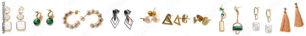 Set of stylish female earrings on white background