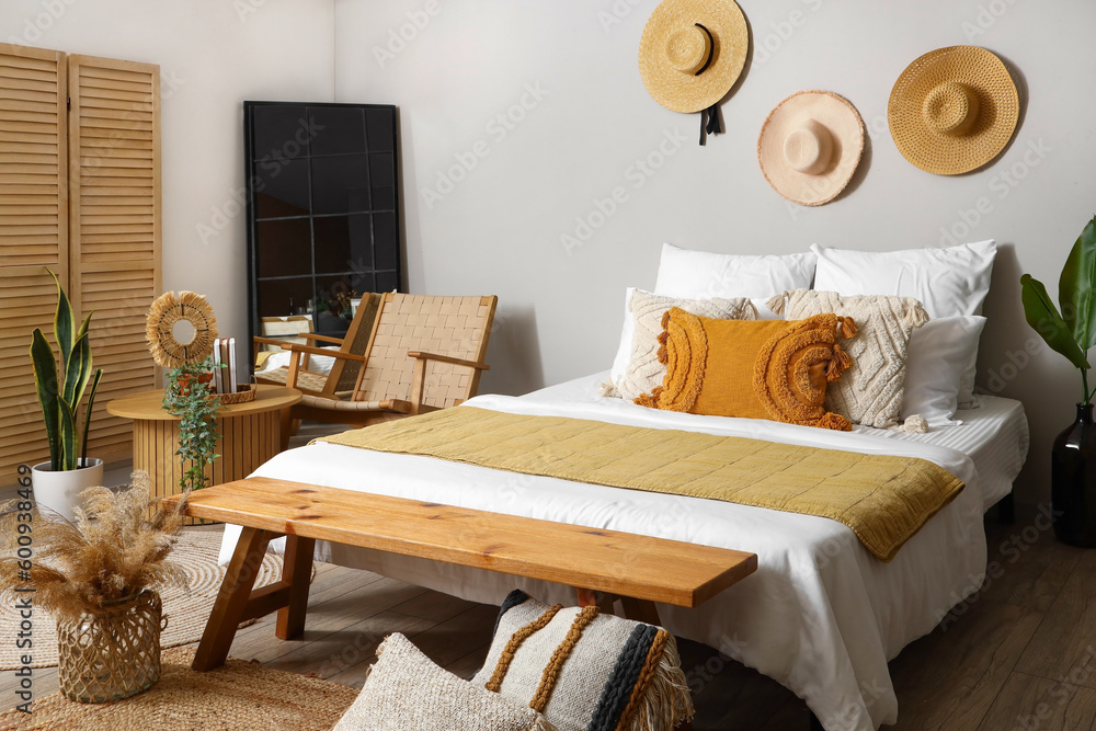 Interior of bedroom with coffee table and armchair